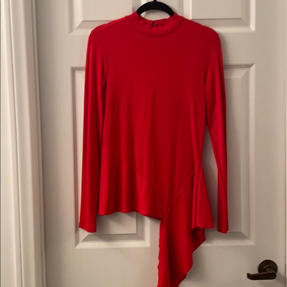Red form fitting statement blouse